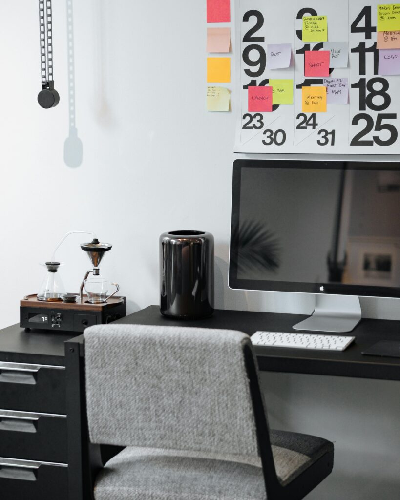 pexels photo 4034477 4034477 A stylish and organized modern workspace featuring a calendar, monitor, and ergonomic chair.